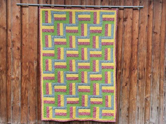 Patchworkdecke Railfence aus Baumwollstoffen nähen lassen