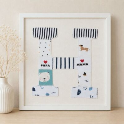 Ein Erinnerungsbild aus Reste und Abschnitte einer fertiggesteltlen Patchworkdecke aus Baby- und Kinderkleidung