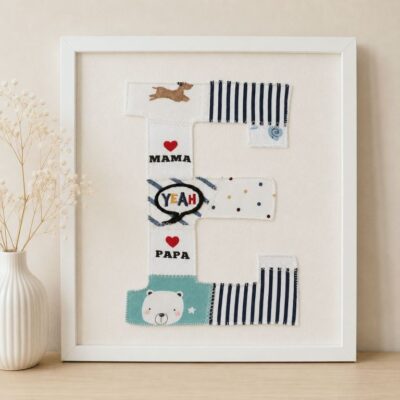 Ein Erinnerungsbild aus Reste und Abschnitte einer fertiggesteltlen Patchworkdecke aus Baby- und Kinderkleidung